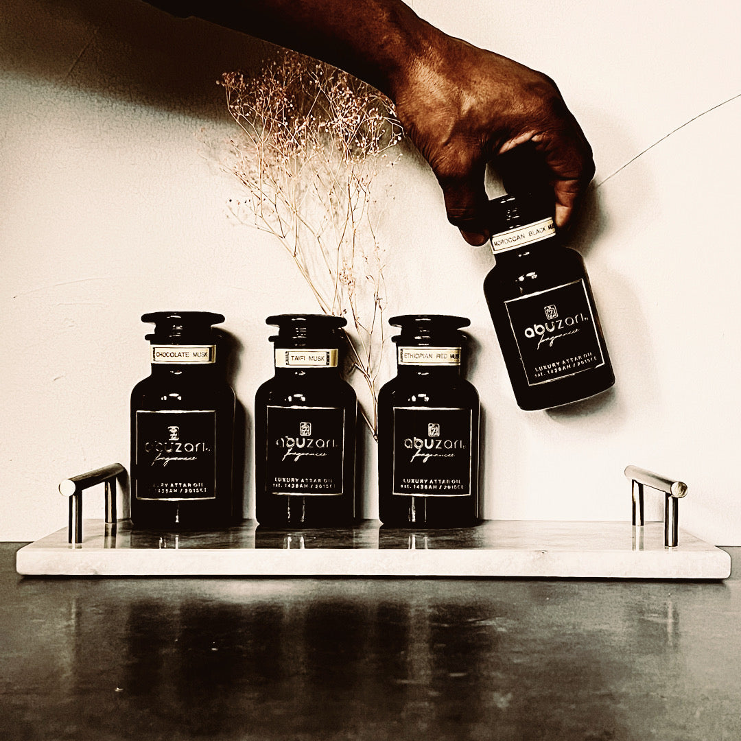 Abu Zari USA brand decanter bottles with featured fragrances Chocolate Musk, Taifi Musk, Ethiopian Red Musk, Moroccan Black Musk