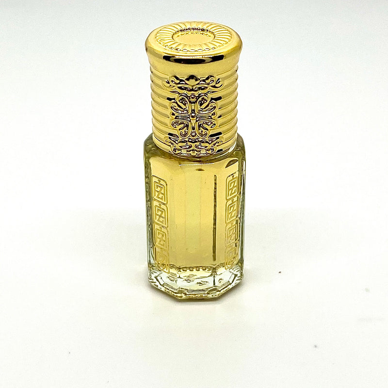 Oud wood perfume oil inside glass attar bottle with Abu Zari Fragrances brand logo, gold royal crown cap.