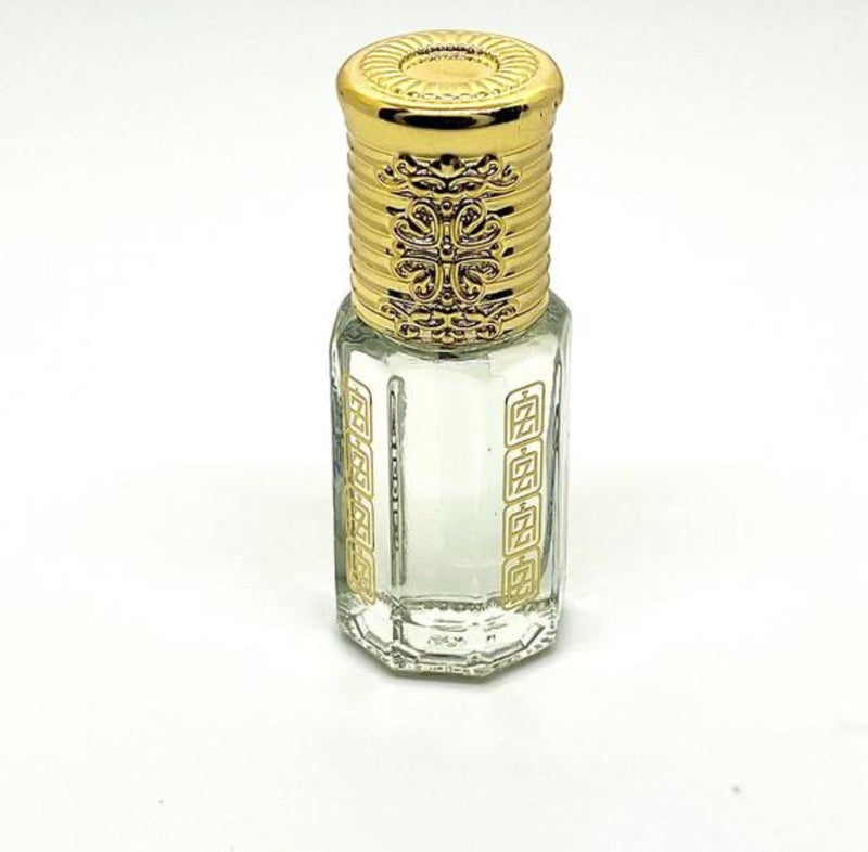 Saudi white musk Arabian perfume oil inside of abu zari branded attar bottle with gold rown cap.